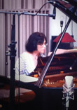 Ellina Akimova playing piano